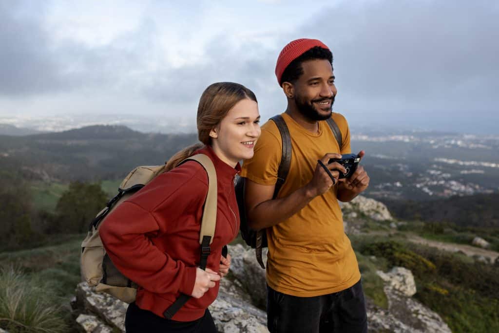 medium shot couple hiking together